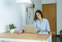 Women Works at Home at Wooden Office Desk