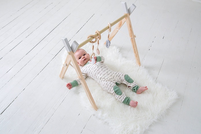baby with baby mobile