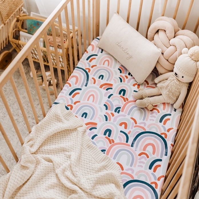 picture of a rainbow baby fitted cot sheet 