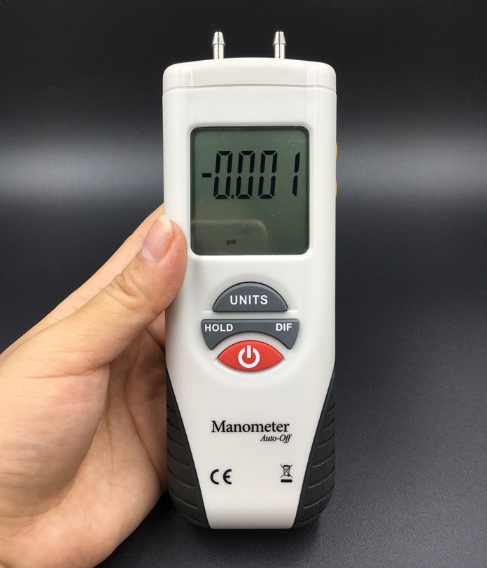 Front view of Digital Manometer Air Pressure Meter shown measures on display