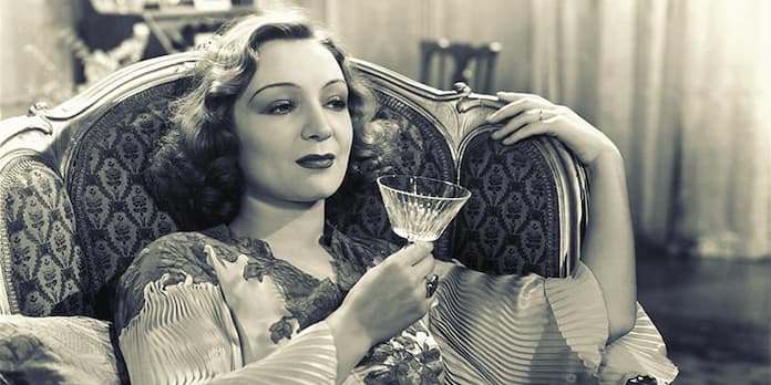 black and white picture of woman drinking gin