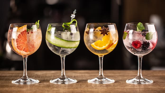 Four gin cocktails with different garnishes
