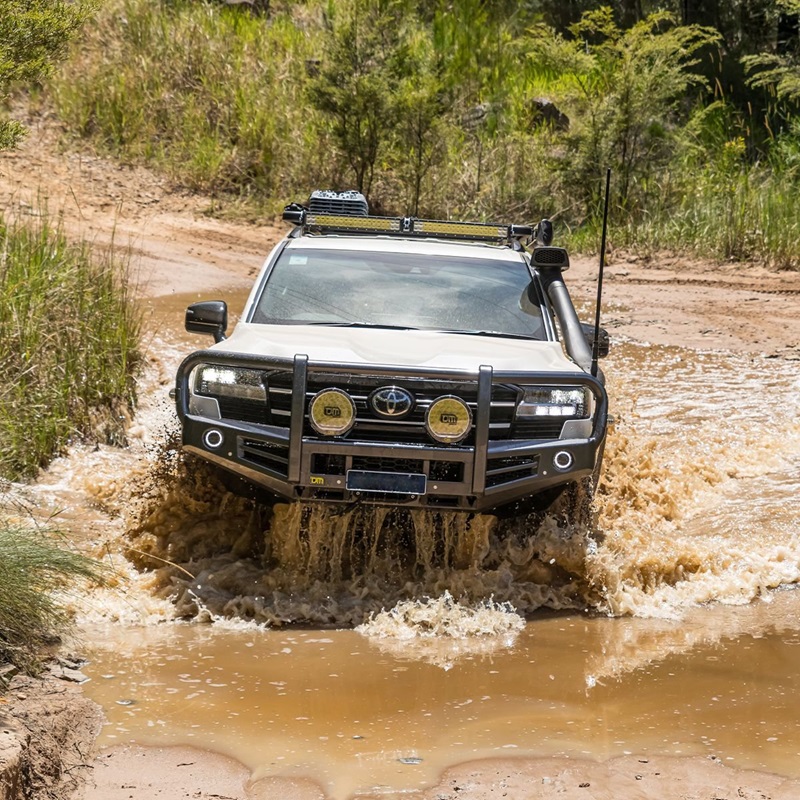 Toyota Land Cruiser offroading in mud and water